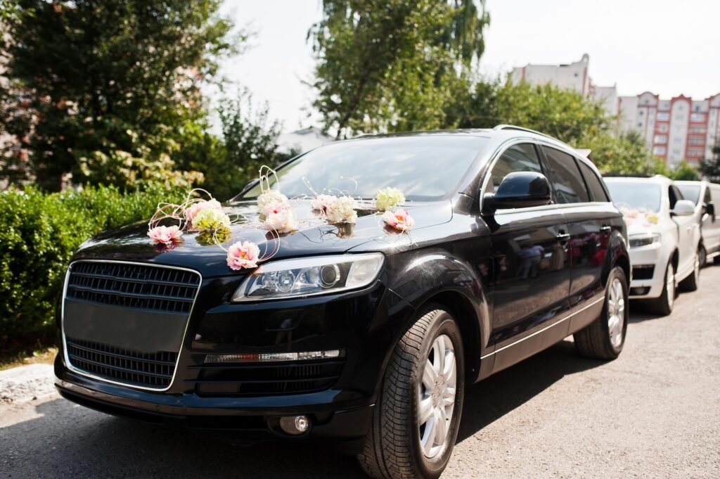 Elegance wedding limousine car with floral decoration.